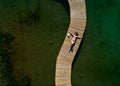 Young beauty woman sunbathing on the sea pier Royalty Free Stock Photo