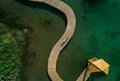 Young beauty woman sunbathing on the sea pier Royalty Free Stock Photo