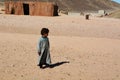 A young Bedouin boy in the desert