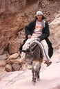 Young Bedouin riding his donkey