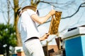 Young beekeeper inspecting beehive frame. Relaxing work in the nature with nice summer light Royalty Free Stock Photo