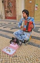 Young beggar musician, Lisbon, Portugal