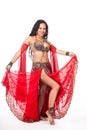 Young belly dancer in red costume