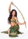 Young belly dancer with sword