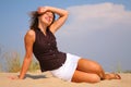 Young beuty woman sit on sand Royalty Free Stock Photo
