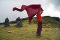 Young Bhutanese novice monk let his robe flutters in the wind , Bhutan.