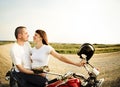 Young biker couple on the country road Royalty Free Stock Photo