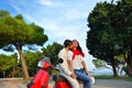 Young biker couple on the country road against the sky Royalty Free Stock Photo