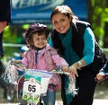 Young biker girl on child bicycle competition.