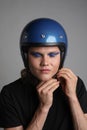 Young biker man wearing retro motorcycle helmet. Vertical photo. . Royalty Free Stock Photo