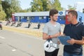 Young biker talking to instructor motorcycle training course