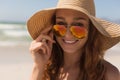 Young bikini Caucasian woman with hat looking over sunglasses Royalty Free Stock Photo