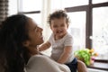 Young biracial mom play with smiling little baby girl Royalty Free Stock Photo