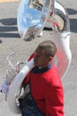 Young black male tuba player in a marching band in the Cherry Blossom Festival in Macon, GA Royalty Free Stock Photo