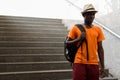 Young black African tourist man walking on stairs Royalty Free Stock Photo