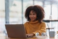 Young black African woman university student learning online using laptop computer. Smiling girl watch webinar or Royalty Free Stock Photo