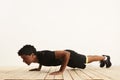 Young black athlete doing pushups