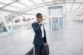 Young Black Businessman Making Mobile Call While Standing With Luggage At Airport Royalty Free Stock Photo