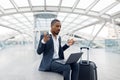 Young Black Businessman Making Video Call On Laptop While Waiting At Airport Royalty Free Stock Photo