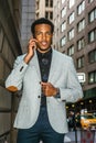 Young black businessman talking on cell phone on street in New York City Royalty Free Stock Photo