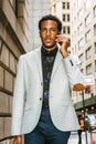 Young black businessman talking on cell phone on street in New York City Royalty Free Stock Photo