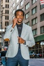 Young black businessman talking on cell phone on street in New York City Royalty Free Stock Photo