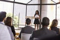 Young black businesswoman presenting seminar to an audience Royalty Free Stock Photo