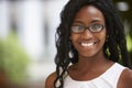 Young black businesswoman wearing glasses, close up