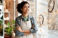 Young black ceramist woman smiling while working in her studio