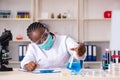 The young black chemist working in the lab Royalty Free Stock Photo