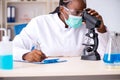 The young black chemist working in the lab Royalty Free Stock Photo