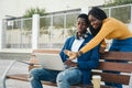 Young black colleagues working on laptop outdoors Royalty Free Stock Photo