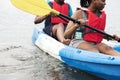 Young black couple canoeing in a lake