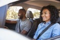 Young black couple in car on a road trip look ahead smiling Royalty Free Stock Photo