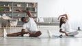 Young black couple doing side bend stretch exercise together Royalty Free Stock Photo