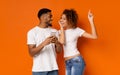 Young black couple enjoying favorite music on cellphone Royalty Free Stock Photo