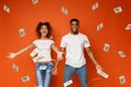 Young black couple enjoying money banknotes shower Royalty Free Stock Photo