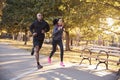 Young black couple jogging in a Brooklyn park Royalty Free Stock Photo