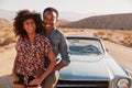 Young black couple on road trip having a roadside stop off Royalty Free Stock Photo