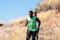 Young Black Couple Running at Forest Trail