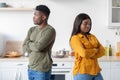 Young Black Couple Standing Back To Back To Each Other In Kitchen Royalty Free Stock Photo