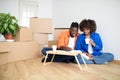 Young Black Family Couple Planning Shopping For New Home, Making Checklist Royalty Free Stock Photo