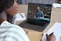 Young black girl student having virtual remote class with indian teacher. Royalty Free Stock Photo