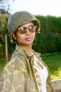 Young black girl with ww2 military helmet Royalty Free Stock Photo