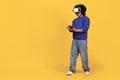 Young black guy wearing VR headset enjoying playing video games Royalty Free Stock Photo