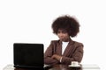 Young black Hispanic business woman, with afro hair, with angry gesture looking at her laptop, in white background Royalty Free Stock Photo