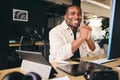 Young Black Male Advertising Marketing Or Design Creative In Modern Office Sitting At Desk Working On Computer Smiling to Camera Royalty Free Stock Photo