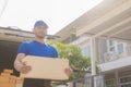 Young black male courier happy delivery with technology, tracking and courier service concept.