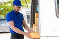 Young black male courier happy delivery with technology, tracking and courier service concept.