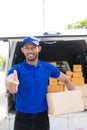Young black male courier happy delivery with technology, tracking and courier service concept.